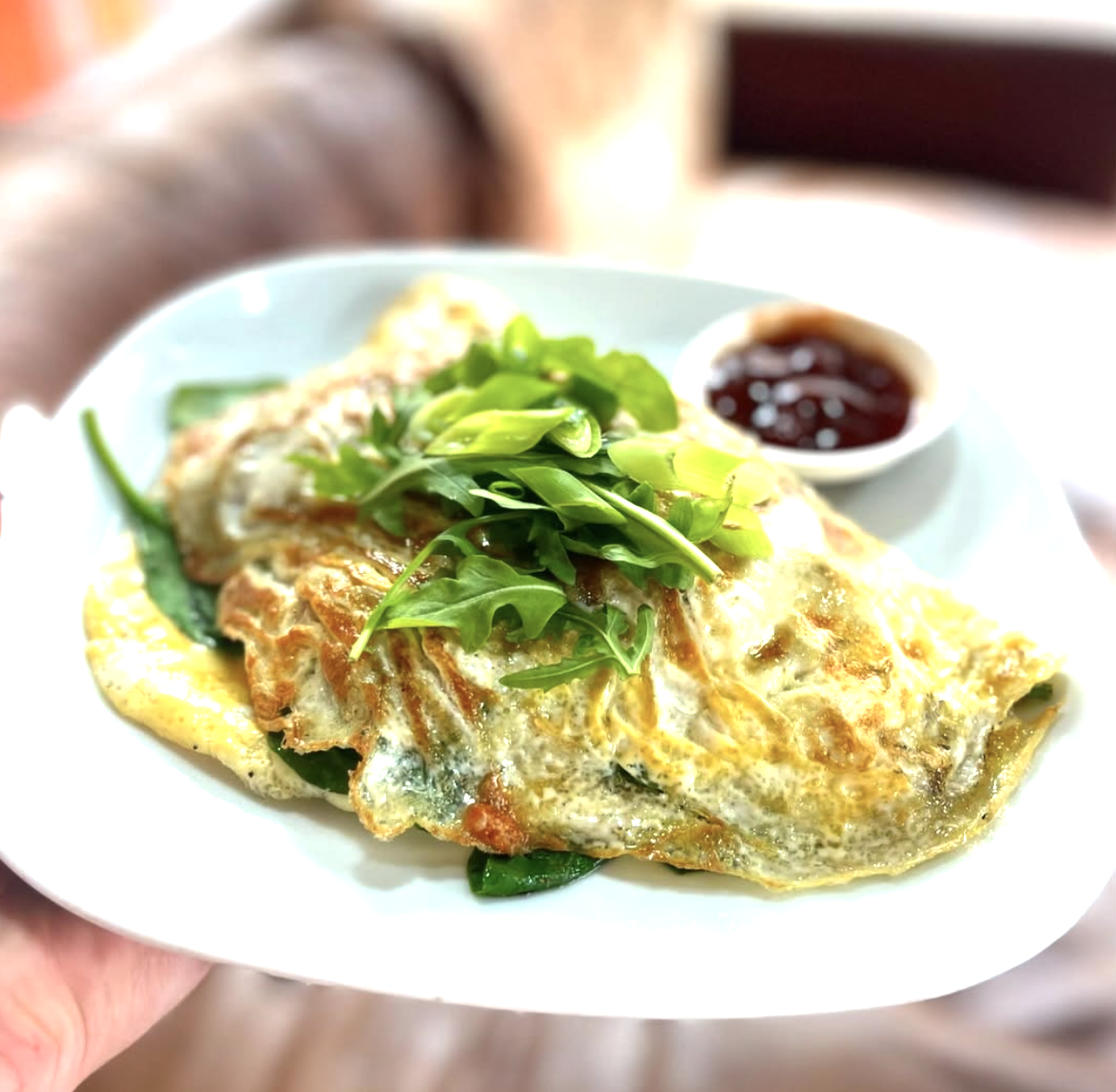 Fluffy omelette with rocket and chutney at Baobab Cafe