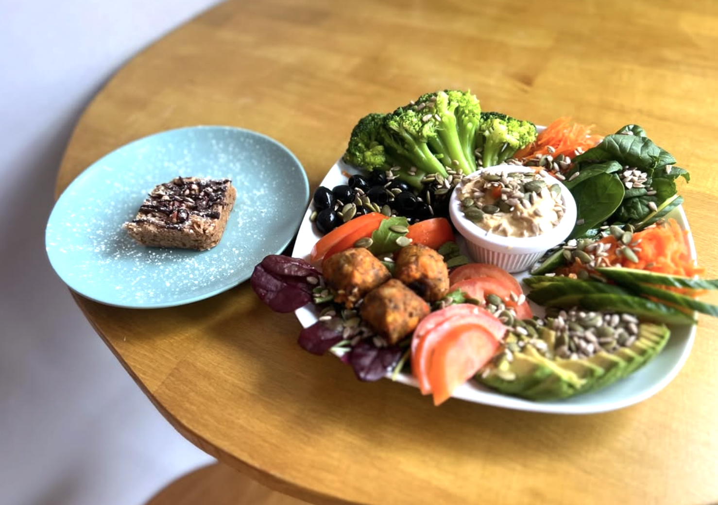 Fresh veggie platter with hummus and a homemade flapjack at Baobab Cafe